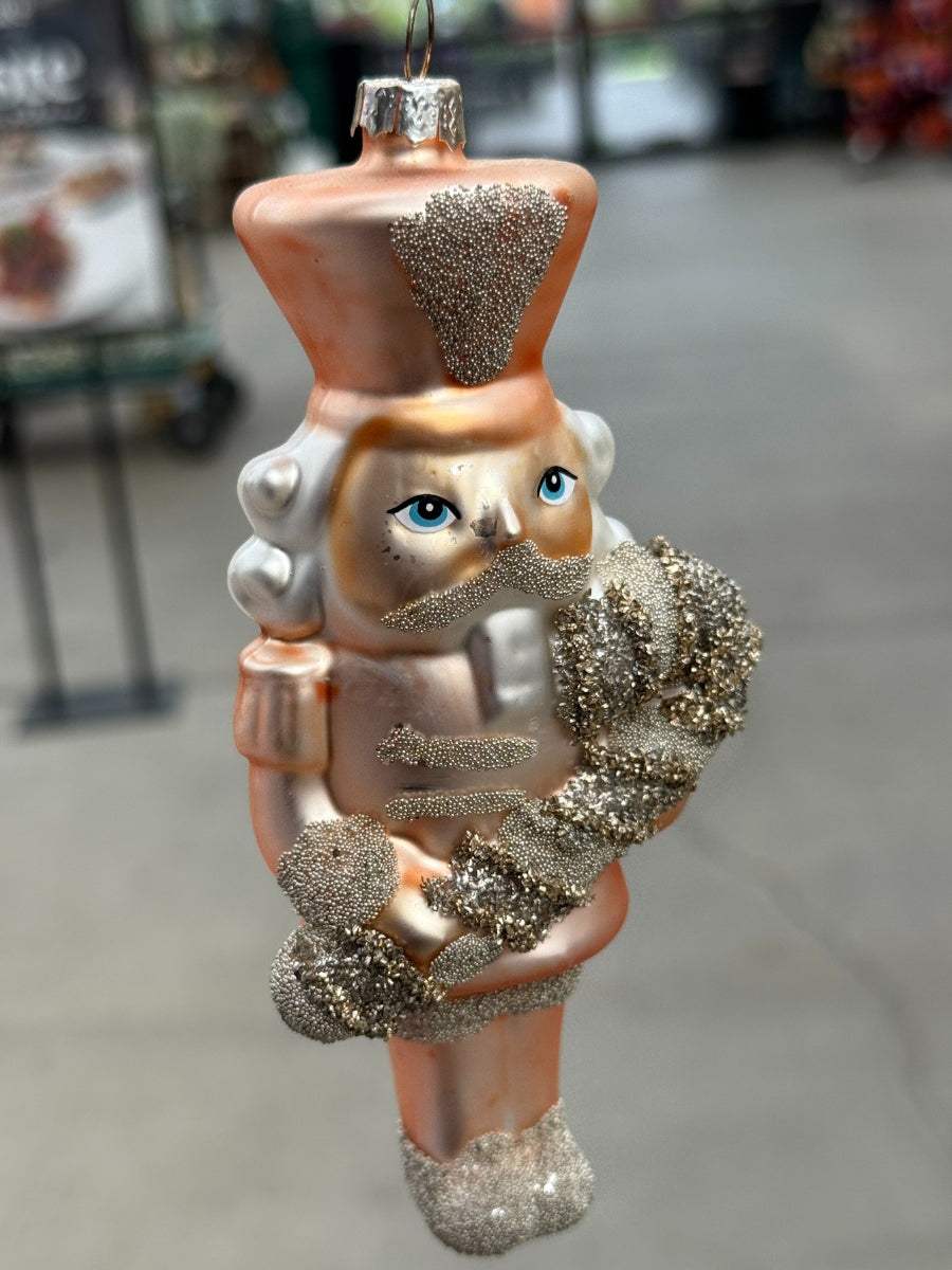 Glass Nutcracker Peach Ornament